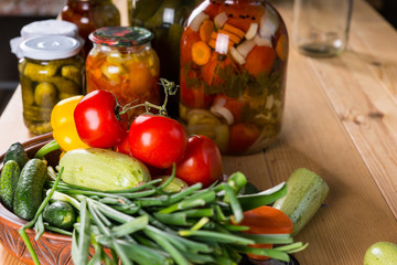 Fresh Vegetables and Jars of Pickles