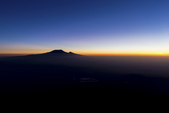 Sunrise Kilimanjaro silhouette from Mt Meru near Arusha in Tanzania. Africa.