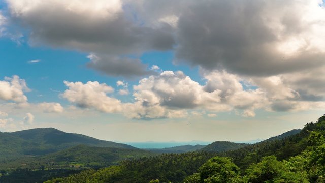 4K Time Lapse. Amazing view from the top of a mountain down to