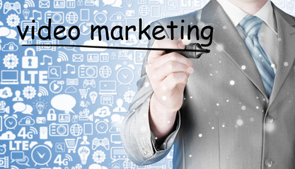 business man writing Video Marketing