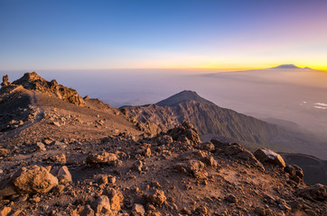 Sunrise on Mount Meru with Mt Kilimanjaro in the distance, near Arusha in Tanzania. Africa. - obrazy, fototapety, plakaty