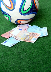 Obraz premium The soccer and the finance