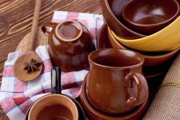 plates and cups on wooden table