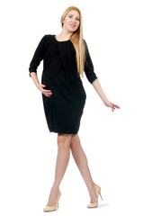 Fototapeta premium Pretty pregnant woman in mini black dress isolated on white