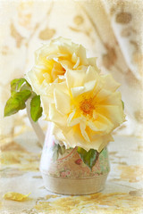 beautiful flowers. yellow roses in a vase on the table.