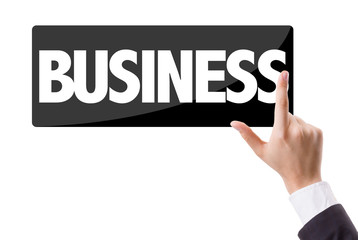 Businessman pressing button with the text: Business