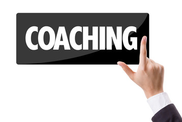Businessman pressing button with the text: Coaching