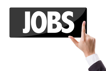Businessman pressing button with the text: Jobs