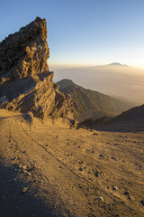 Sunrise on Mount Meru with Mt Kilimanjaro in the distance, near Arusha in Tanzania. Africa.