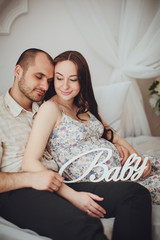 Beautiful pregnant woman with her husband