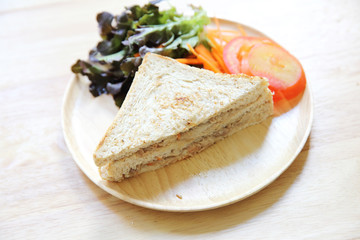 tuna sandwich on wood background