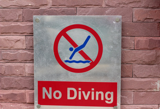 Prohibition sign jump off into the pool on the floor
