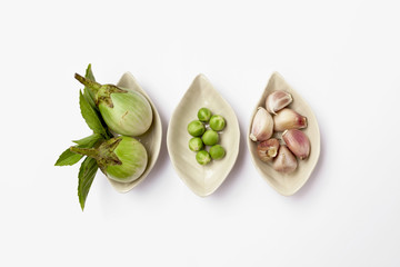 Vegetable in ceramic cup on white background
