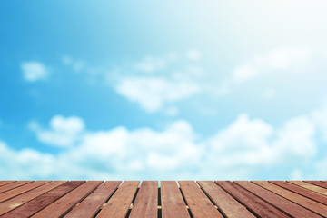 Blue sky with wooden floor