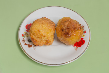 grilled sticky rice made into balls dip to egg on the white dish
