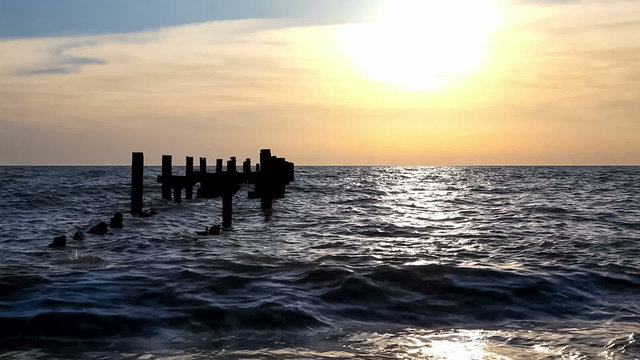 Abandoned pier at sunset 