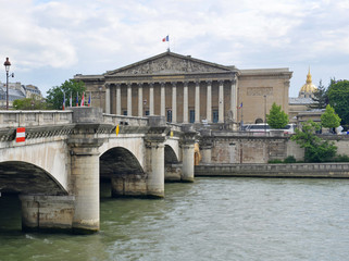 Fototapeta na wymiar Scene along Seine River with Bridge