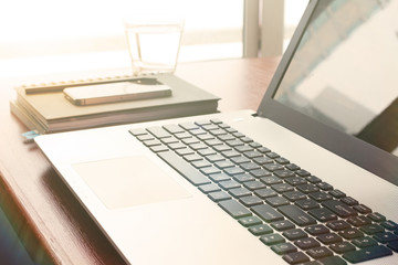  laptop computer is on wooden desk as workplace concept
