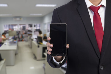 businessman  using mobile smart phone on office background