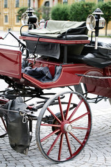 Fototapeta na wymiar Red european tourist cart carriage