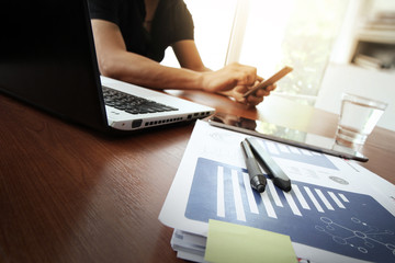Young creative designer man working at office and social network