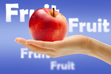 Female hand with red apple