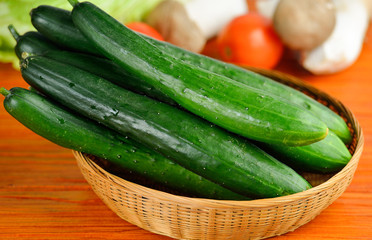 Fresh cucumber on wooden  background