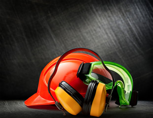 Red helmet with earphones and goggles