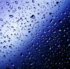 Cold rain drops on window