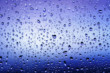 Cold rain drops on window