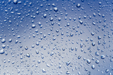 Cold rain drops on window