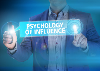 Businessman presses button psychology of influence on virtual sc