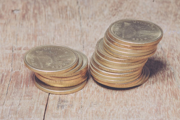 coins on wood with filter effect retro vintage style