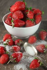 Strawberries in bowl with sugar
