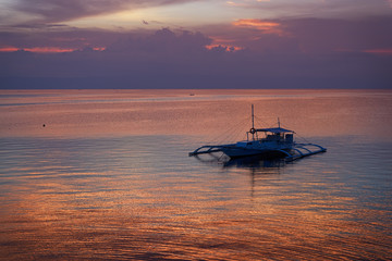 Sunset with a Banka boat in Bohol, Philippines.