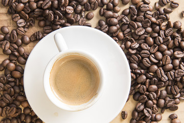 Coffee espresso on a brown beans background