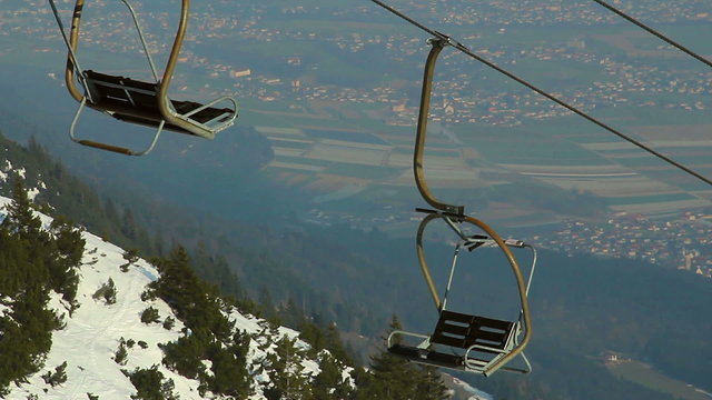 Abandoned cable way, off-season at skiing resort, tourism crisis