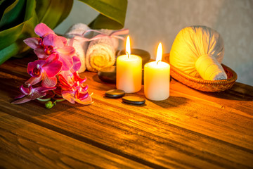 spa concept of pink orchid flower, thai herbal compress balls in