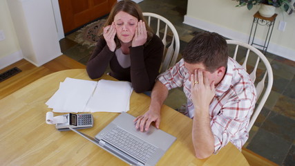 Couple stressed about bills and finances - Powered by Adobe