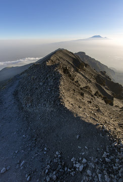 Views over to Mt Kilimanjaro from Mt Meru in Tanzania, Africa.