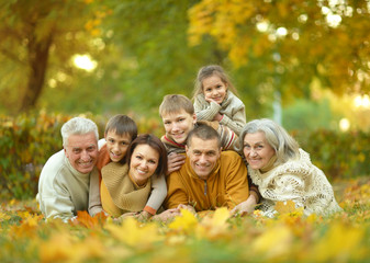  Family relaxing in autumn park