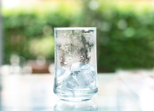 the ice cube in glass that out of water
