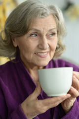Senior woman with cup of coffee