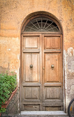 Fototapeta na wymiar Old wooden brown house door