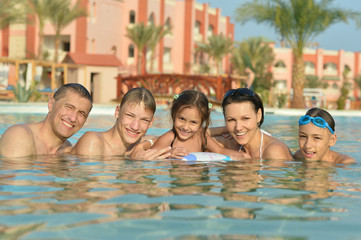 Happy family in  pool
