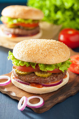 burger with beef patty lettuce onion tomato ketchup