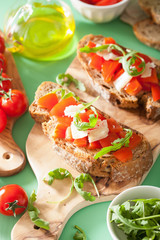 italian bruschetta with tomatoes parmesan rucola