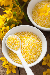 spa with yellow herbal bath pearls and flowers