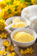 spa with yellow herbal bath pearls and flowers