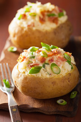 baked potato in jacket with bacon and cheese